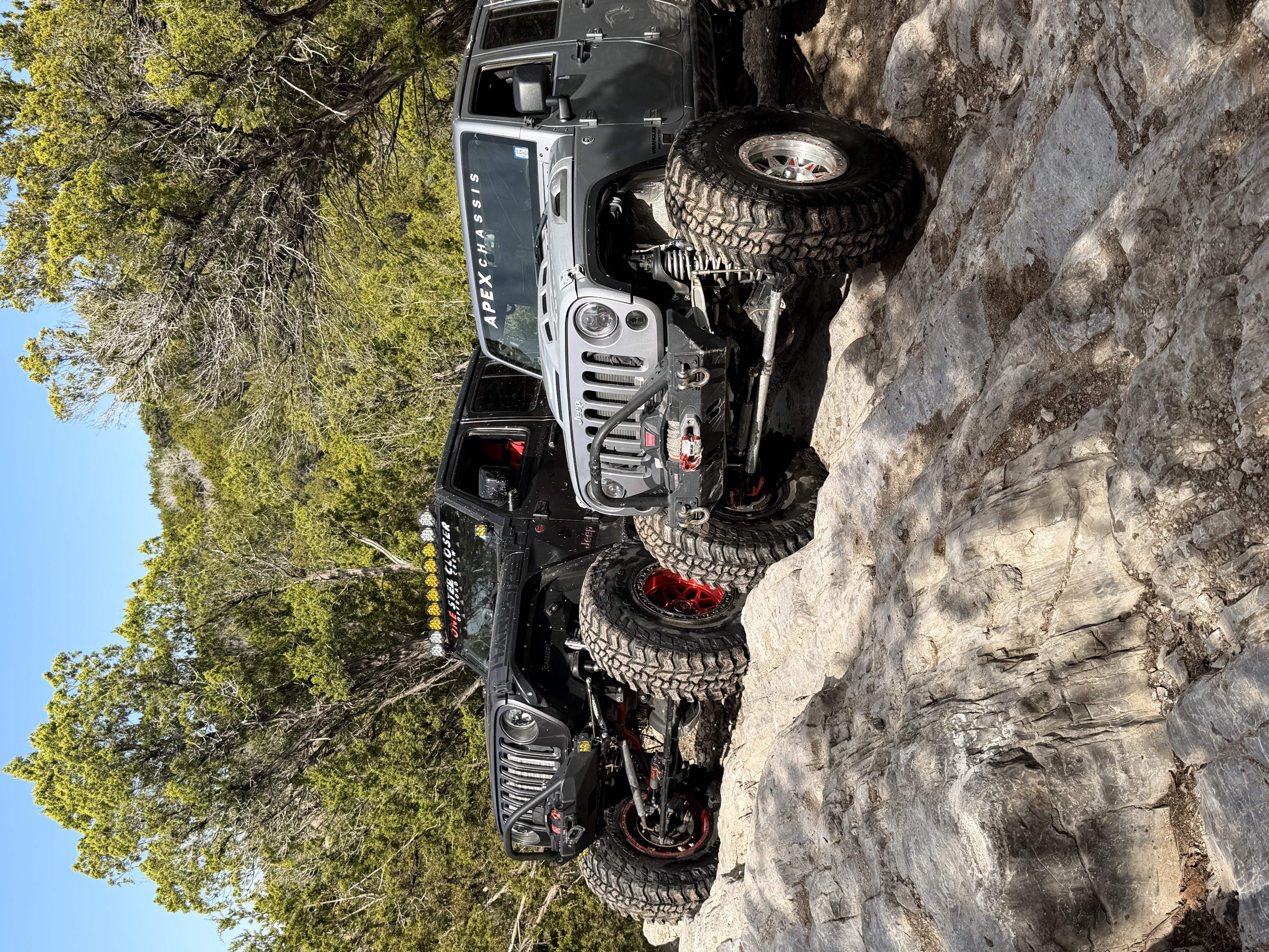 Two Jeeps on rock face
